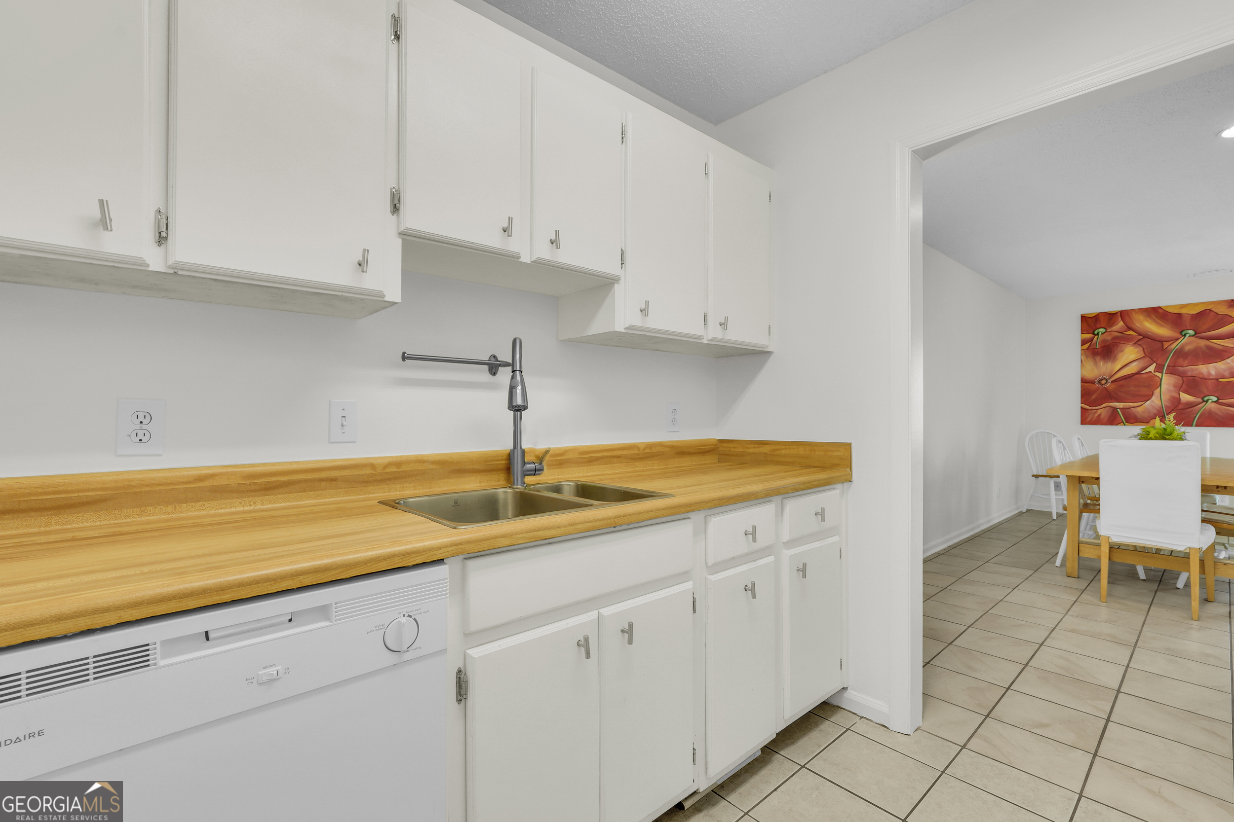 114 South Island Square Drive St. Simons, GA 31522 - Photo 26 of 51 a kitchen with a sink and cabinets