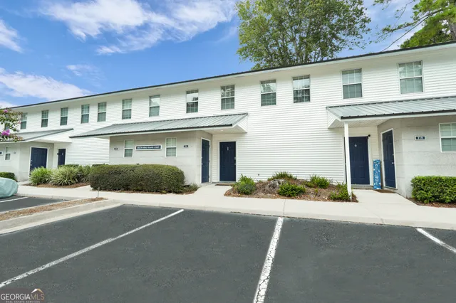 a front view of a building with yard