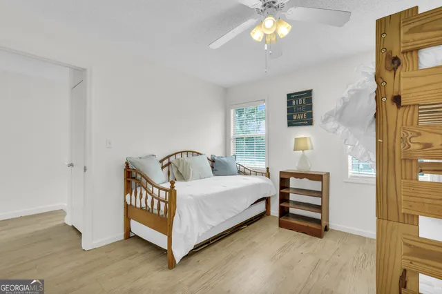 a bed room with a bed and a chandelier