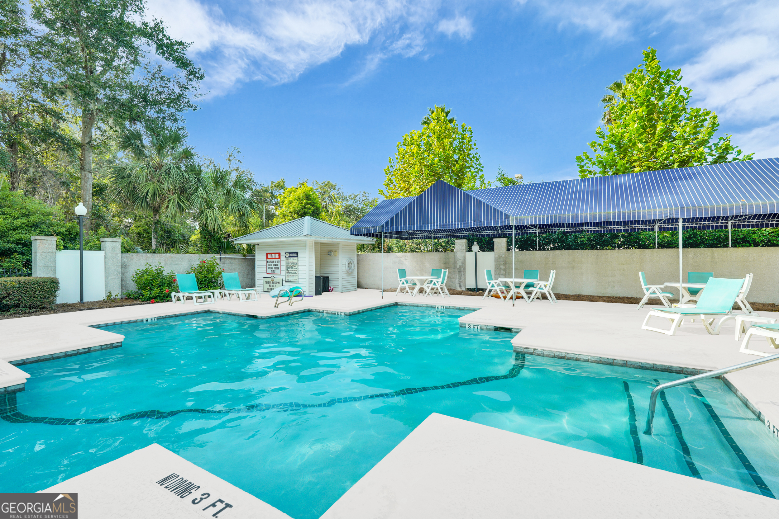114 South Island Square Drive St. Simons, GA 31522 - Photo 48 of 51 a view of backyard with swimming pool and outdoor seating
