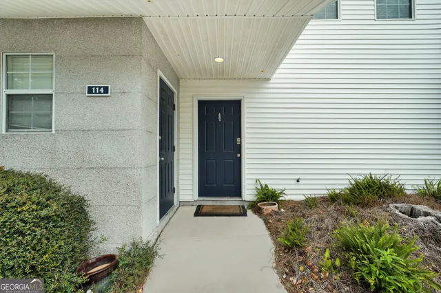 a view of a pathway besides a house