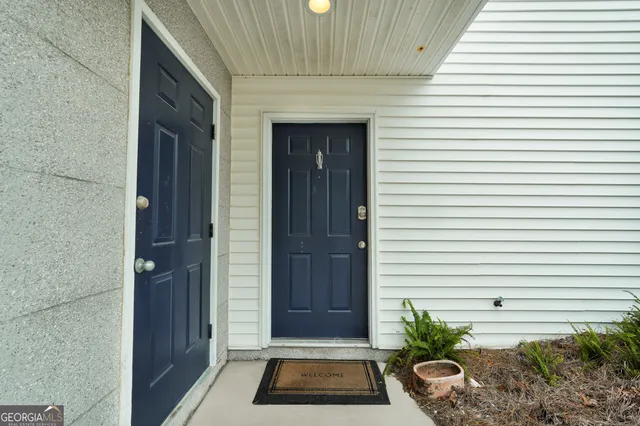 a view of a entryway door front of house