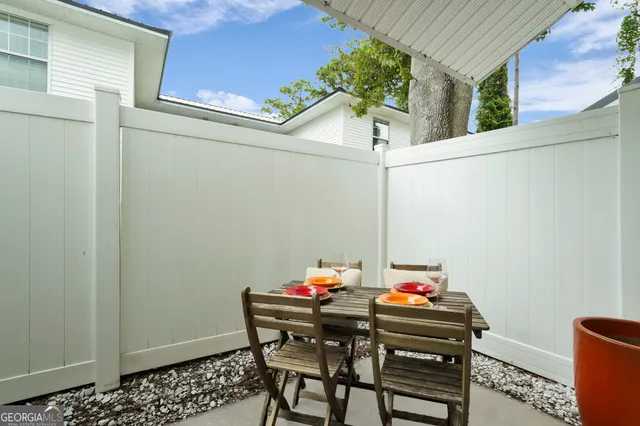 a table and chairs in a balcony