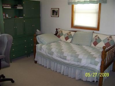 8806 Liable Road Highland, IN 46322 - Photo 5 of 10 a bedroom with a bed and a window