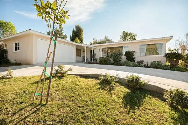 a view of a house with swimming pool