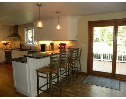 30 Wamsutta Ridge Road Charlton, MA 01507 - Photo 12 of 42 a kitchen with a dining table chairs and large window