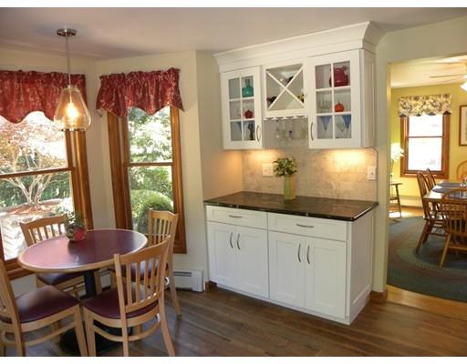 30 Wamsutta Ridge Road Charlton, MA 01507 - Photo 14 of 42 a kitchen with granite countertop a table and chairs in it