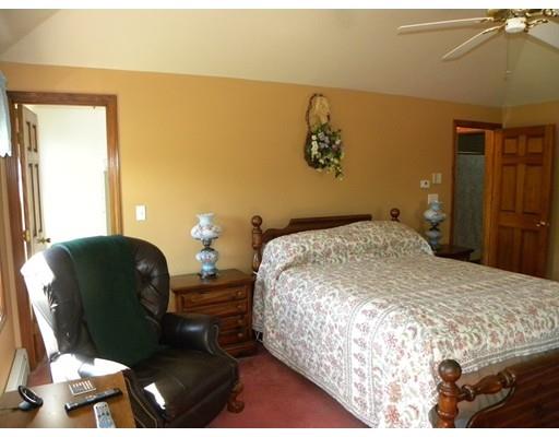 30 Wamsutta Ridge Road Charlton, MA 01507 - Photo 19 of 42 a bedroom with a bed and wooden floor