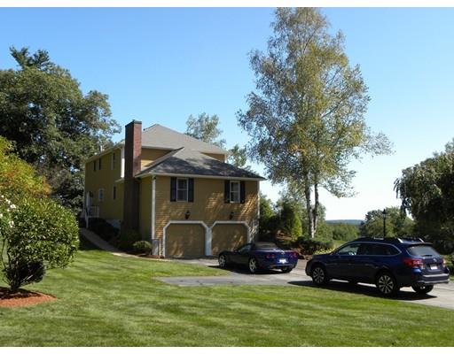 30 Wamsutta Ridge Road Charlton, MA 01507 - Photo 39 of 42 a car parked in front of the house