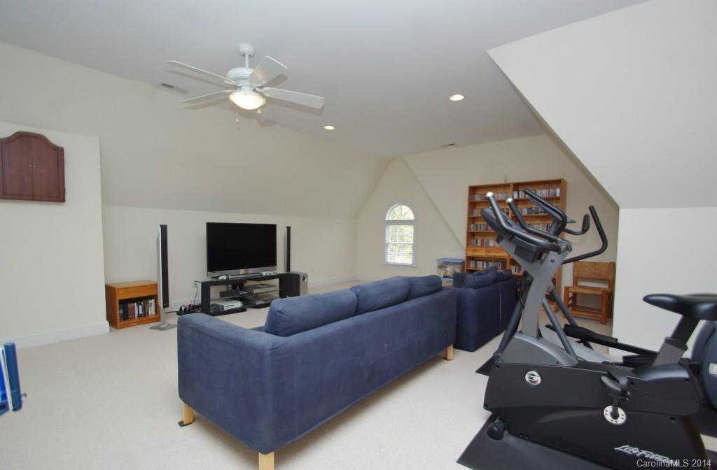 1640 Windy Ridge Road Charlotte, NC 28270 - Photo 13 of 22 a living room with furniture and a flat screen tv