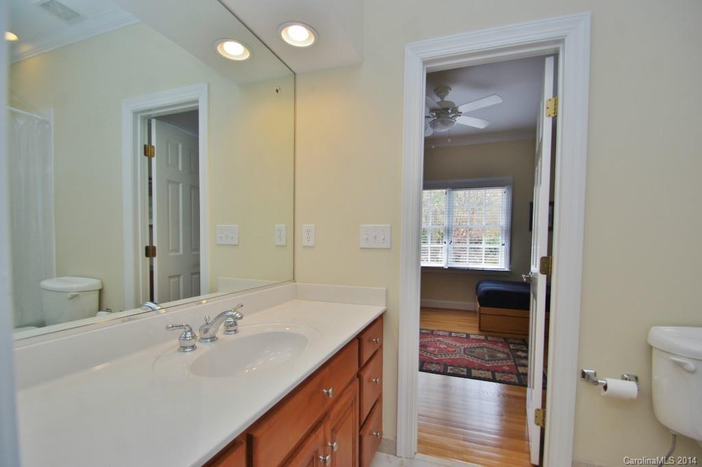 1640 Windy Ridge Road Charlotte, NC 28270 - Photo 18 of 22 a en suite bathroom with a granite countertop sink and a mirror