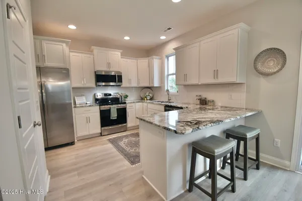 $450,720 | 167 South Bandwheel Way, Hampstead, NC 28443