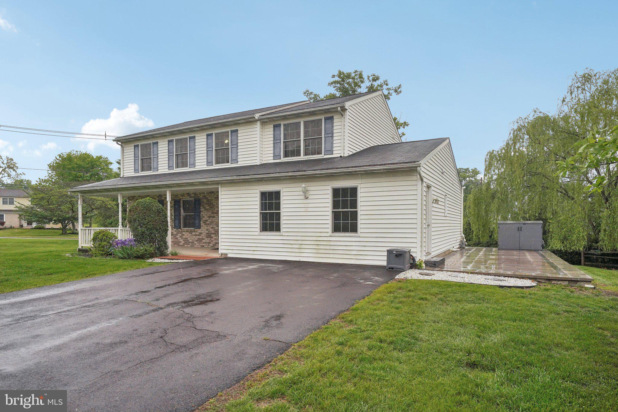 3026 Highley Road Eagleville, PA 19403 - Photo 2 of 46 a front view of a house with a yard and potted plants