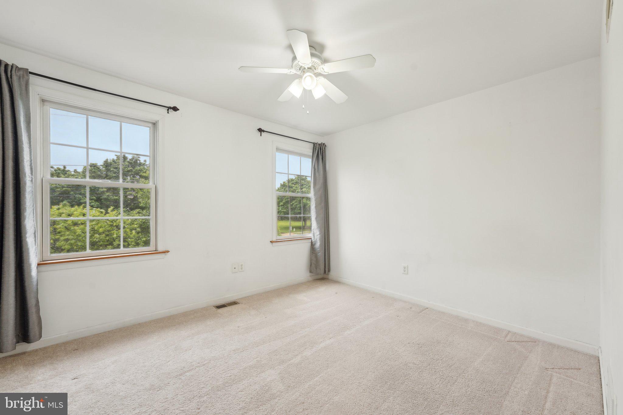 3026 Highley Road Eagleville, PA 19403 - Photo 33 of 46 an empty room with a window and a fan