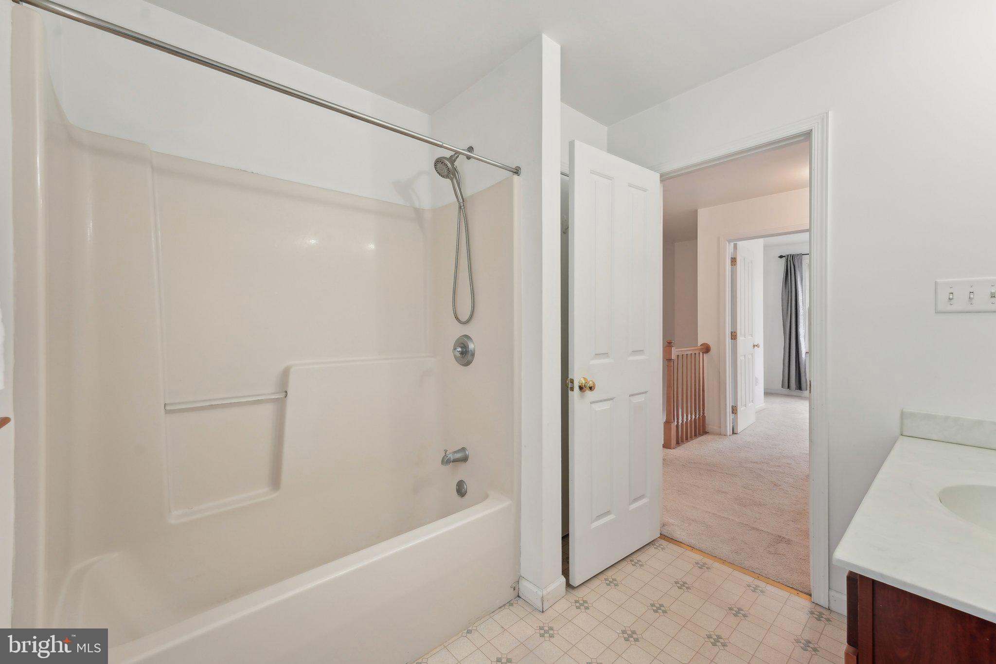3026 Highley Road Eagleville, PA 19403 - Photo 35 of 46 a bathroom with a bathtub and a shower