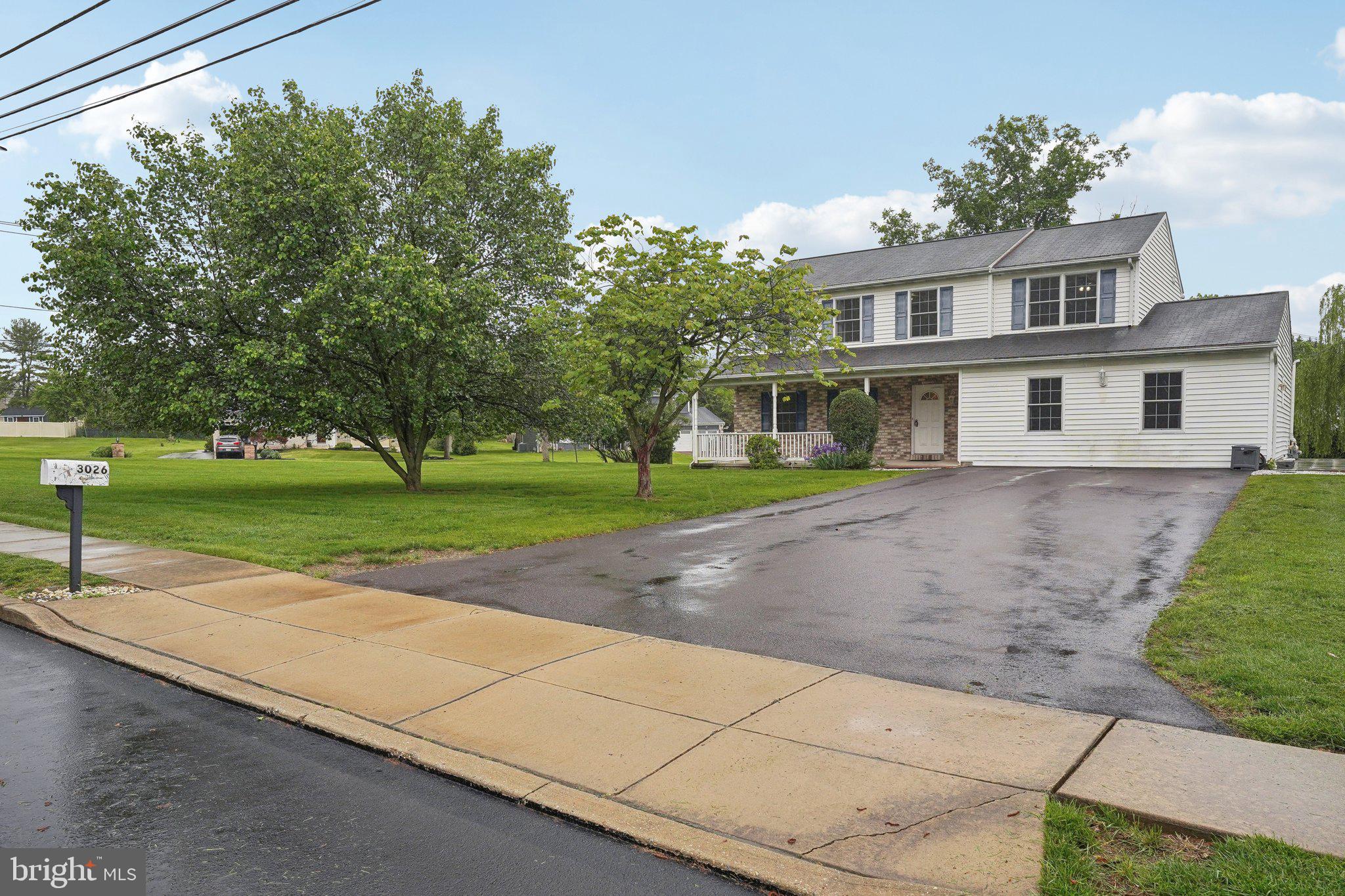 3026 Highley Road Eagleville, PA 19403 - Photo 4 of 46 a view of a house with a yard and potted plants