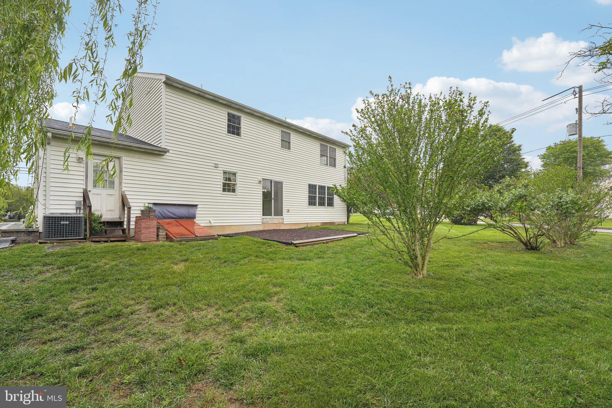 3026 Highley Road Eagleville, PA 19403 - Photo 41 of 46 a backyard of a house with table and chairs