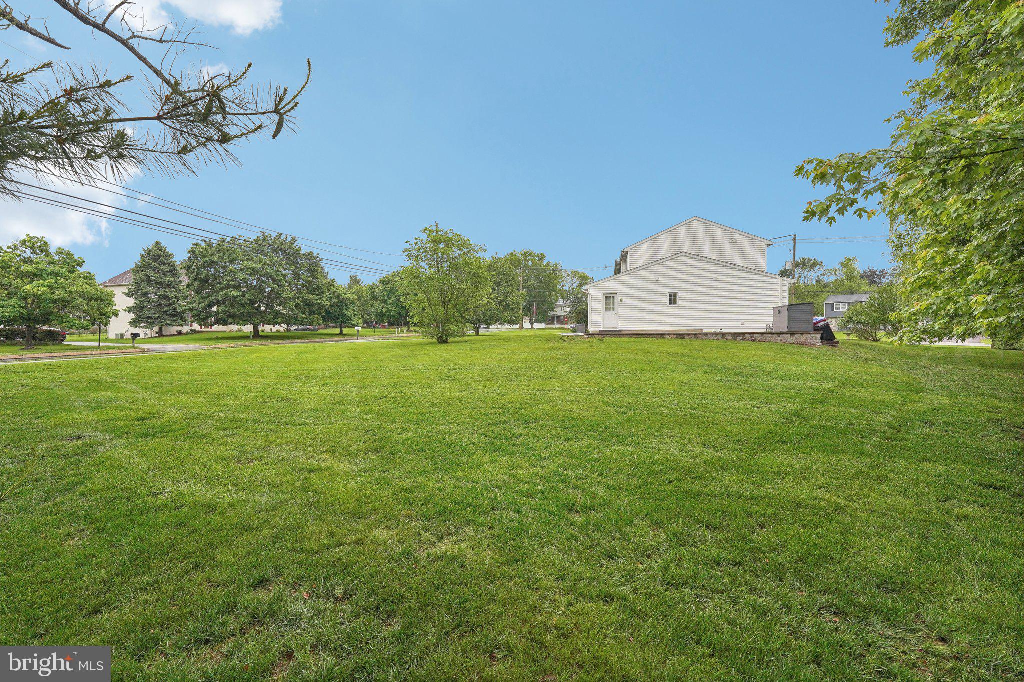 3026 Highley Road Eagleville, PA 19403 - Photo 42 of 46 a view of a big room with a big yard and potted plants
