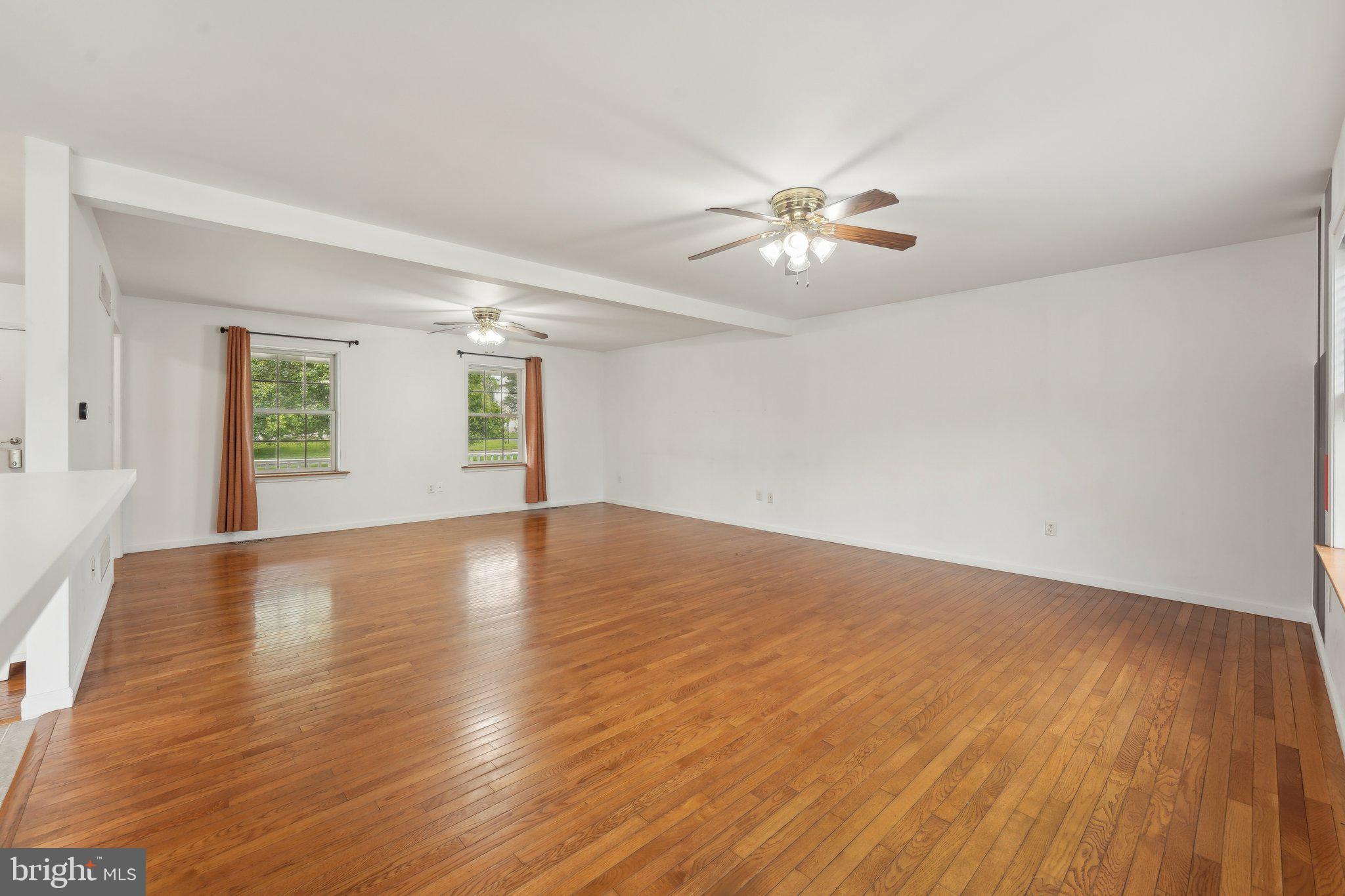 3026 Highley Road Eagleville, PA 19403 - Photo 6 of 46 a view of empty room with wooden floor and fan