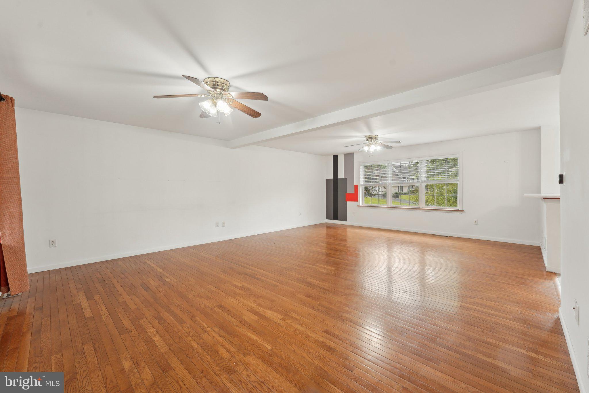 3026 Highley Road Eagleville, PA 19403 - Photo 7 of 46 a view of an empty room with window and wooden floor