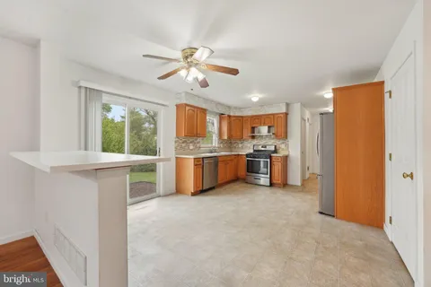 a view of a kitchen with a sink cabinet and a window