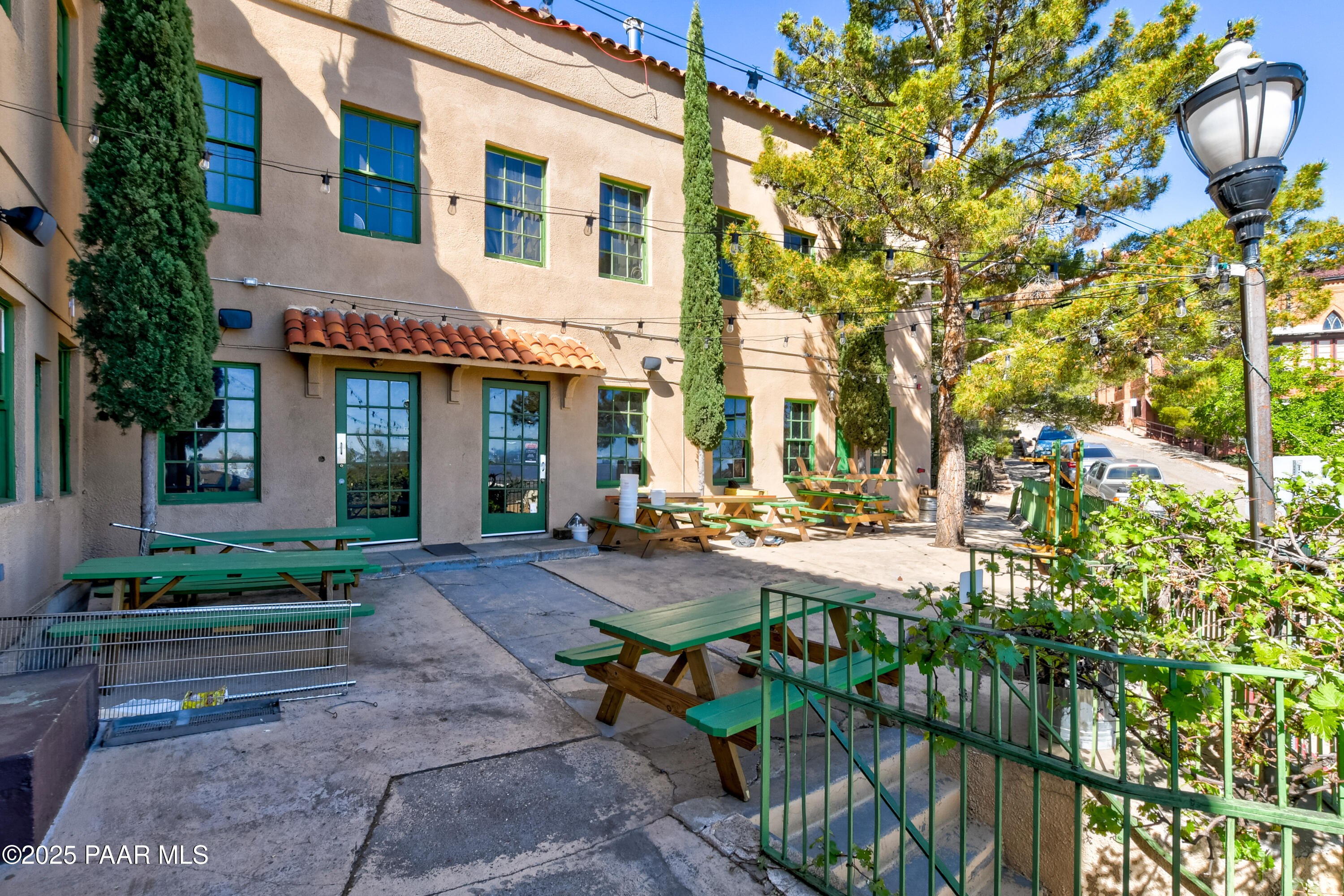 403 Clark Street Jerome, AZ 86331 - Photo 14 of 60 a view of a patio with table and chairs and potted plants