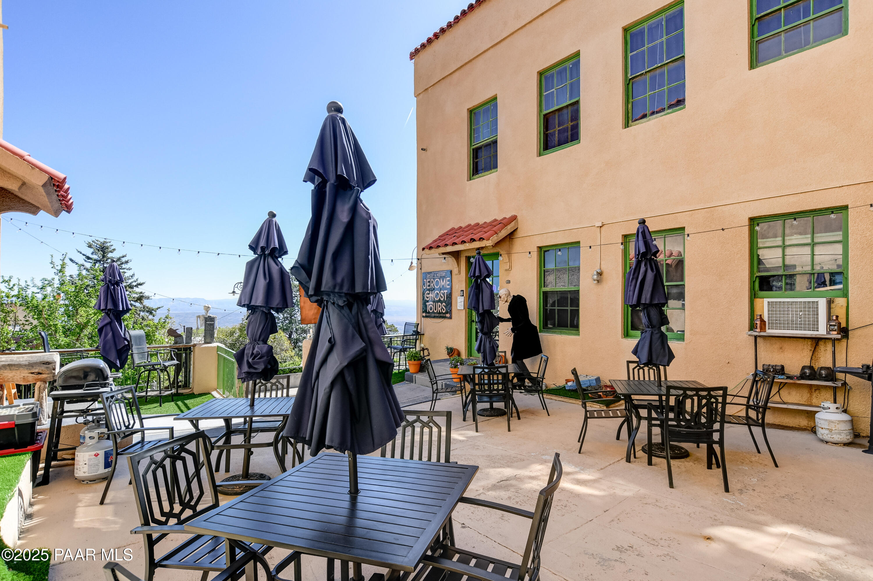 403 Clark Street Jerome, AZ 86331 - Photo 15 of 60 a view of a dinning table and chairs in patio