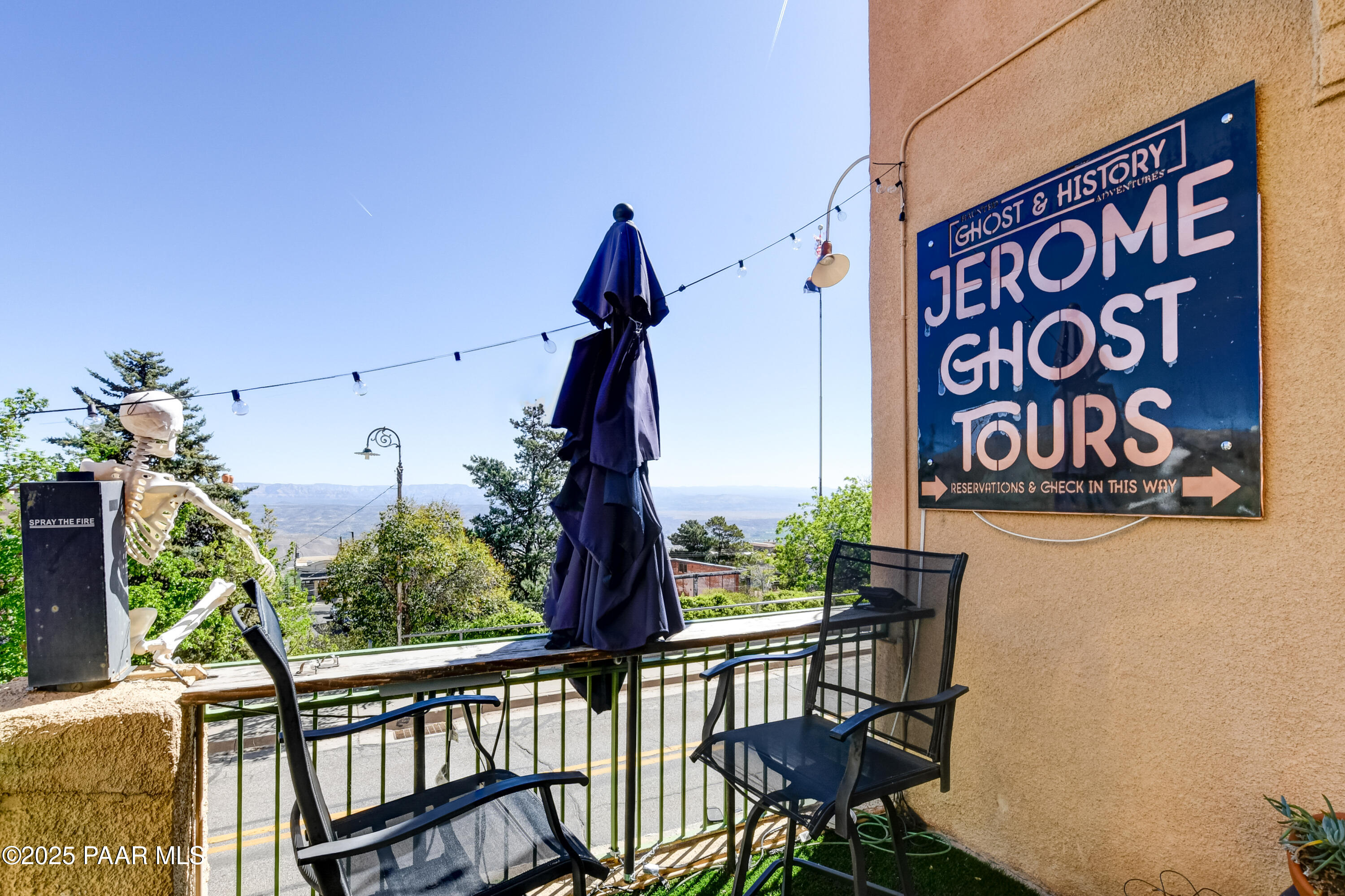 403 Clark Street Jerome, AZ 86331 - Photo 17 of 60 a view of a chairs and table in the balcony