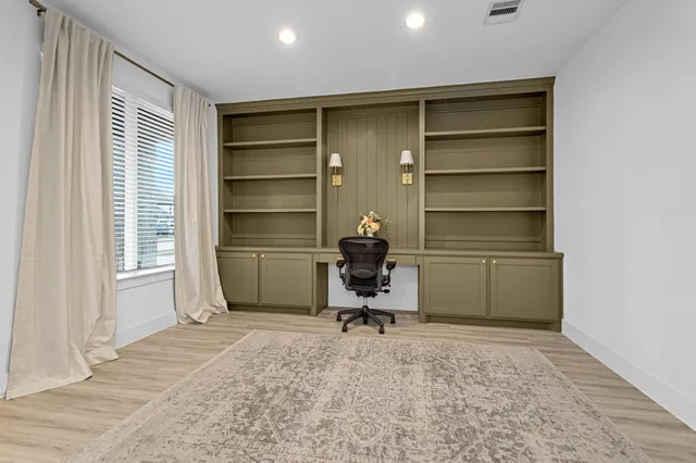 a room with a chair and a window