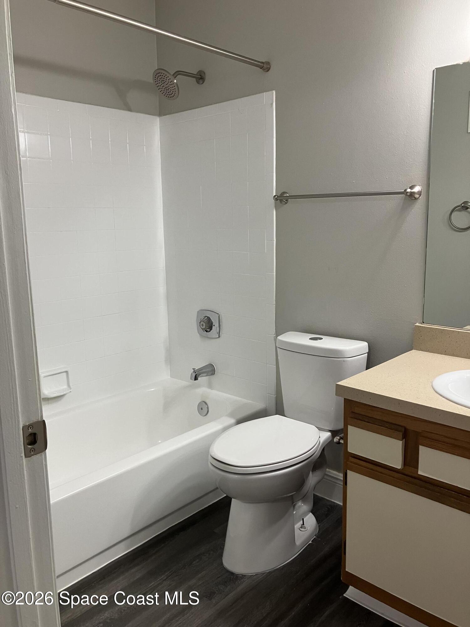 7667 North Wickham Road, Unit 1318 Melbourne, FL 32940 - Photo 12 of 18 a bathroom with a toilet and a bathtub