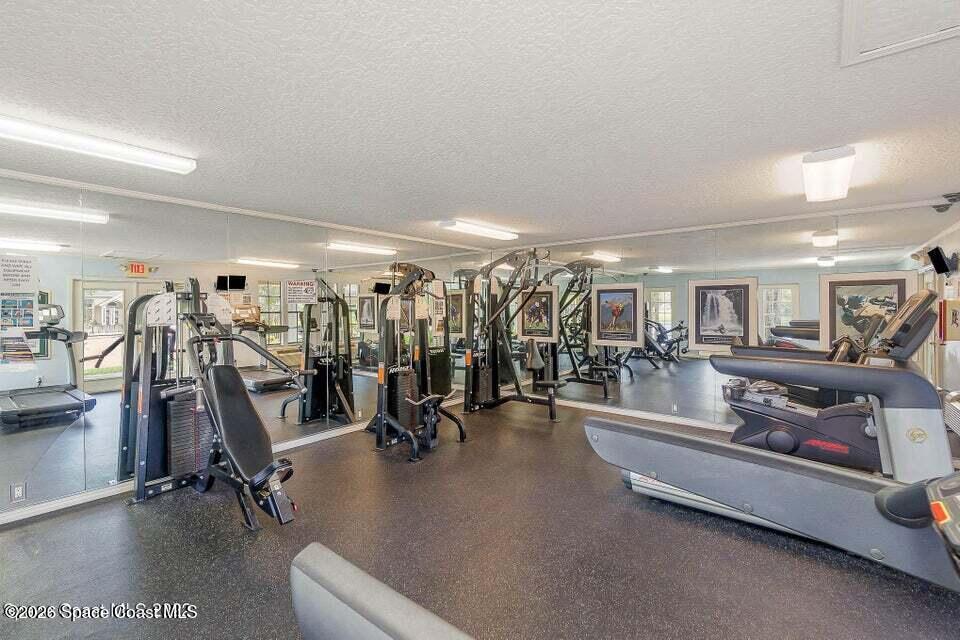 7667 North Wickham Road, Unit 1318 Melbourne, FL 32940 - Photo 18 of 18 a view of a room with gym equipment