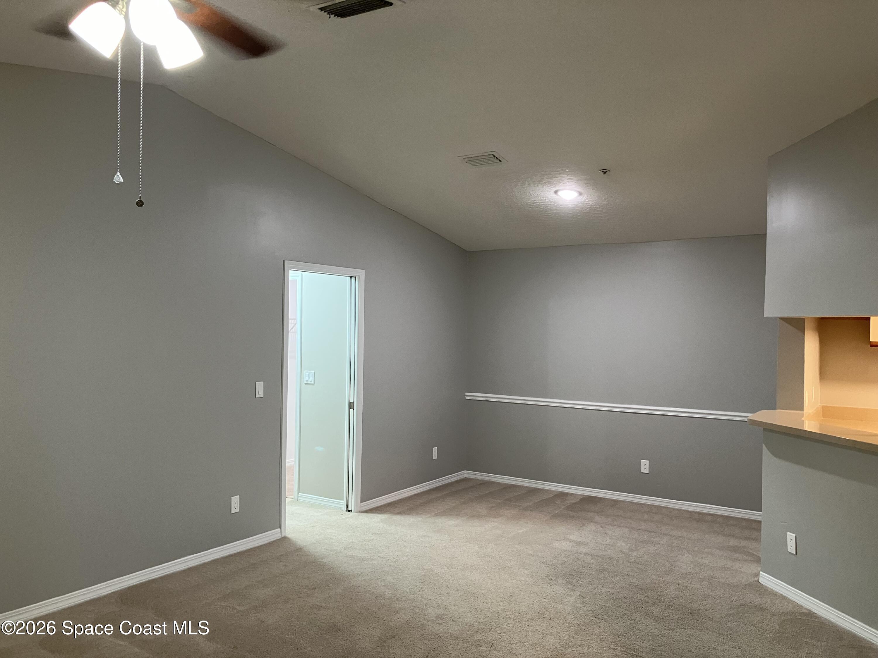 7667 North Wickham Road, Unit 1318 Melbourne, FL 32940 - Photo 6 of 18 a view of an empty room with a window