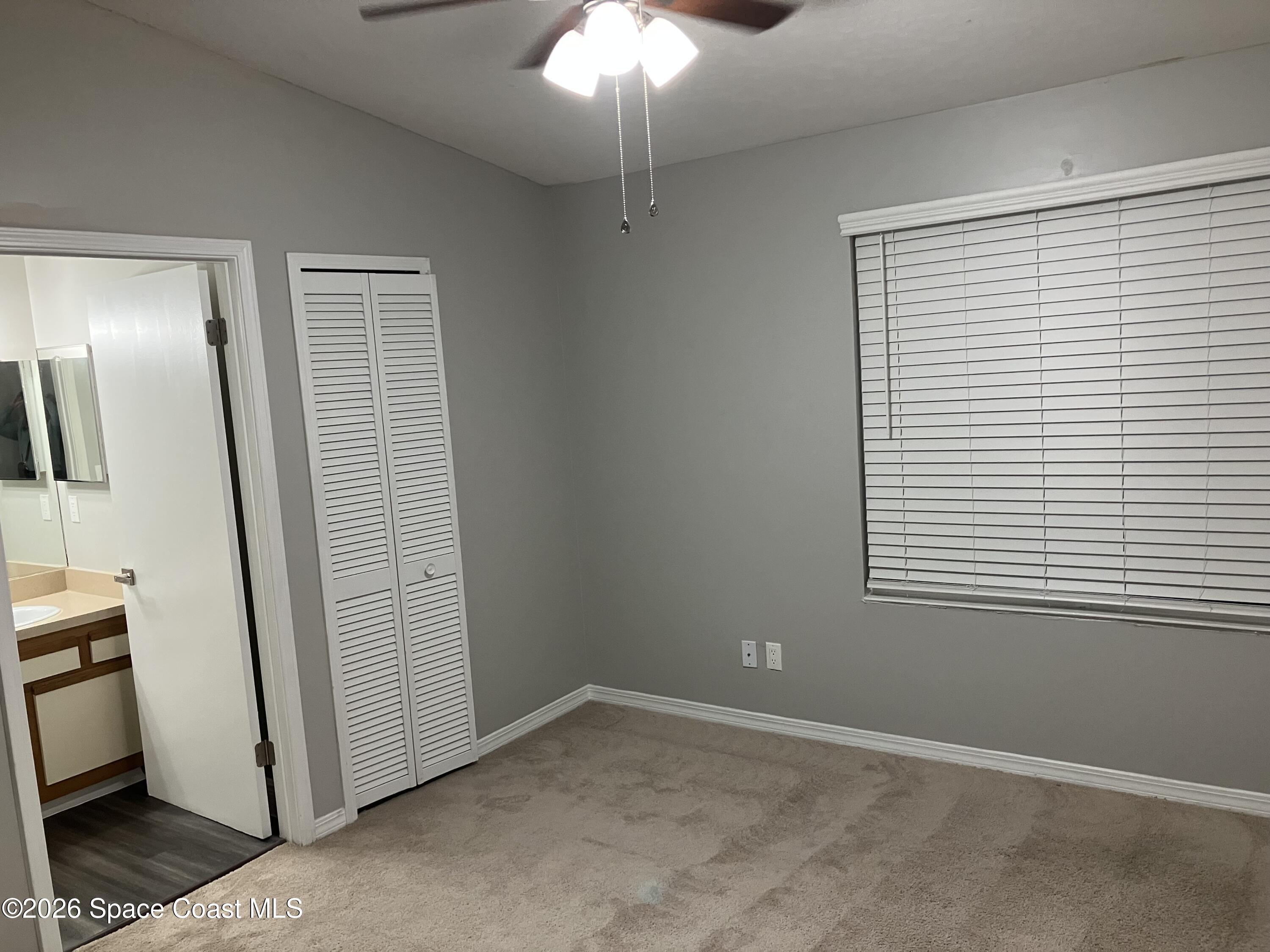 7667 North Wickham Road, Unit 1318 Melbourne, FL 32940 - Photo 8 of 18 a view of an empty room with a fireplace
