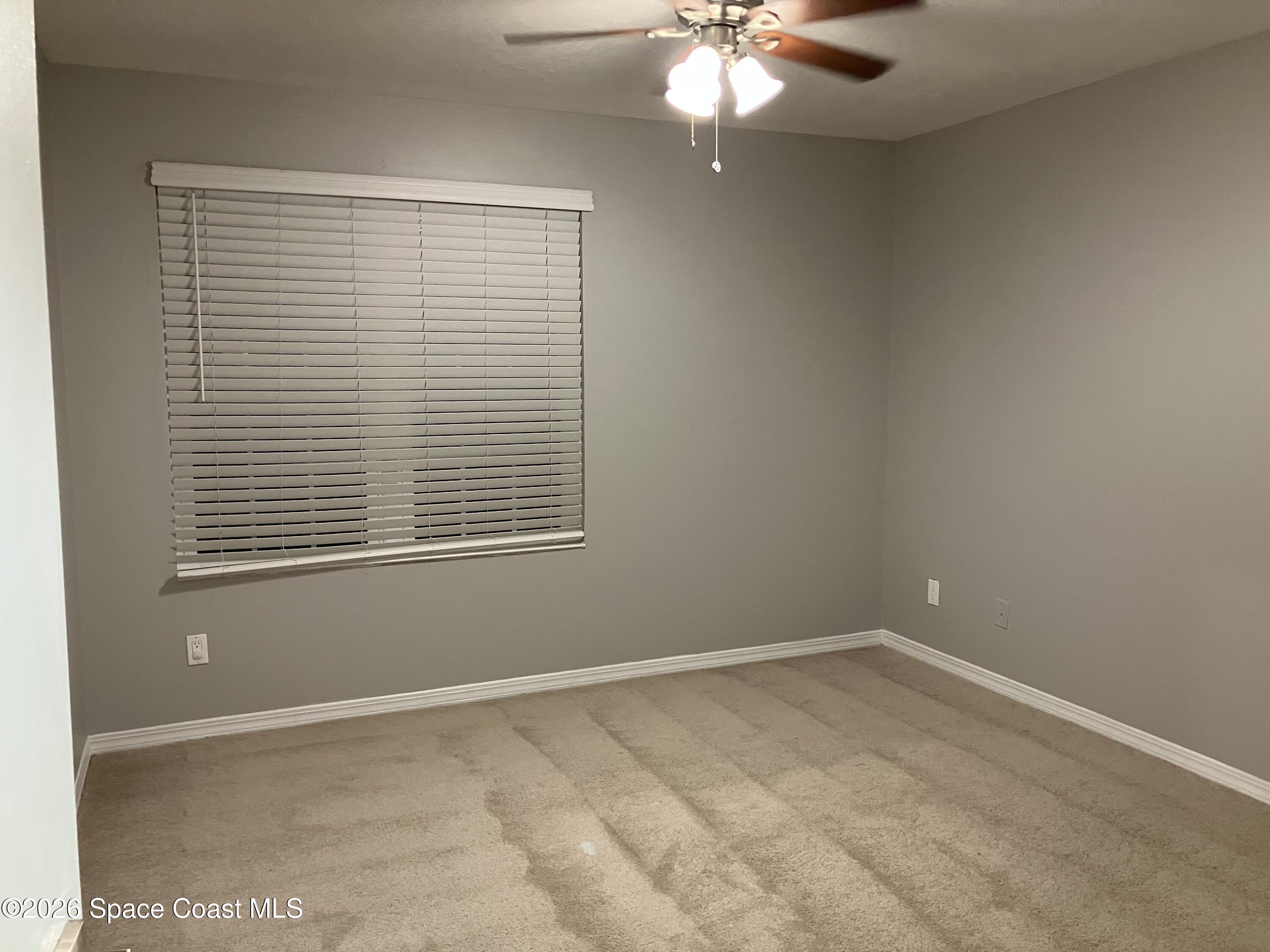 7667 North Wickham Road, Unit 1318 Melbourne, FL 32940 - Photo 10 of 18 an empty room with a window