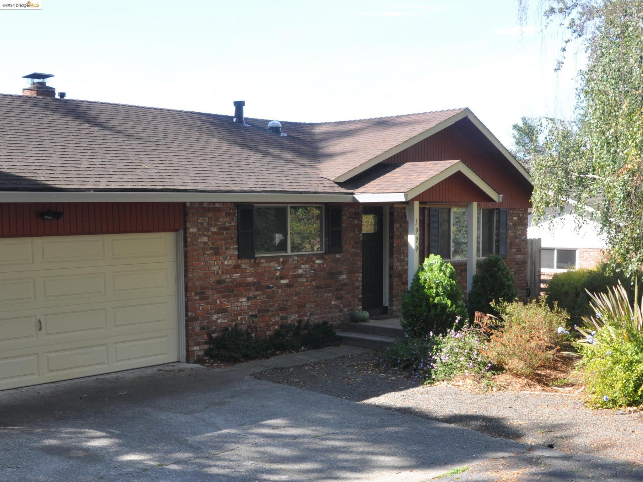 3999 Roblar Road Petaluma, CA 94952 - Photo 1 of 1 a front view of a house with garden