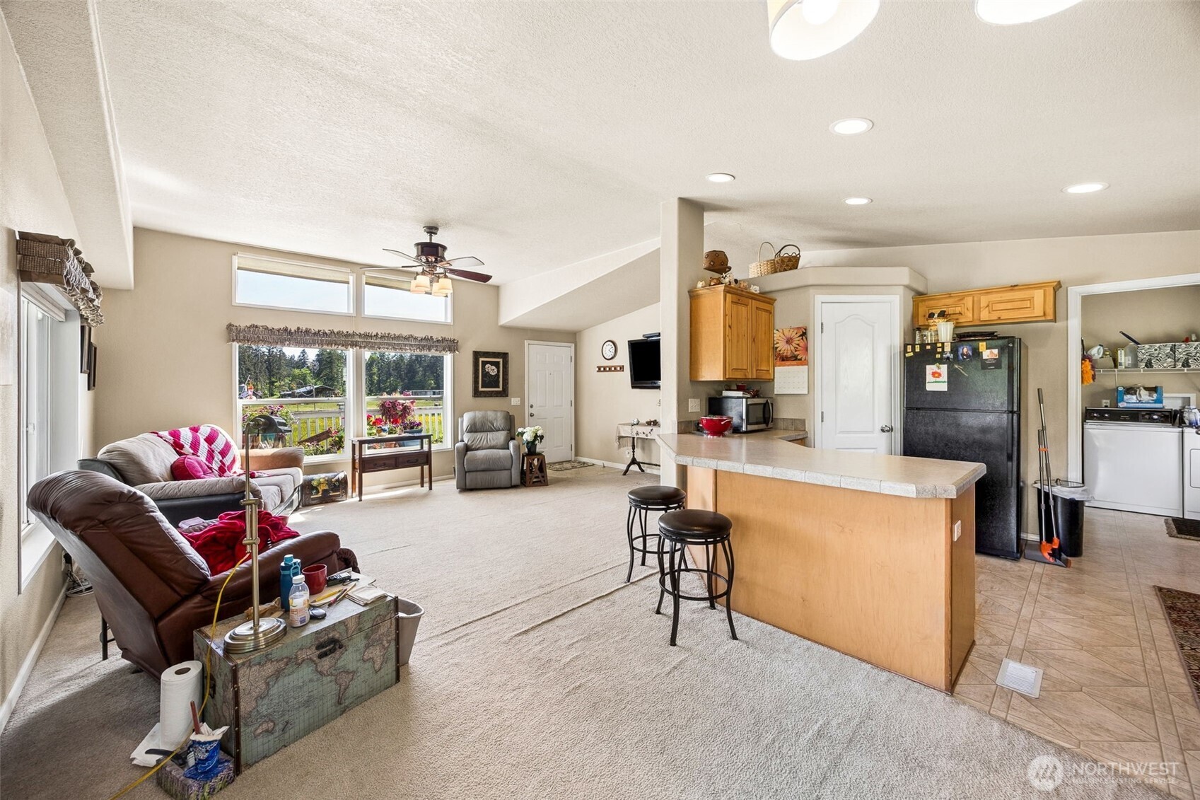 1716 304th Street East Roy, WA 98580 - Photo 18 of 21 a living room with furniture and a large window