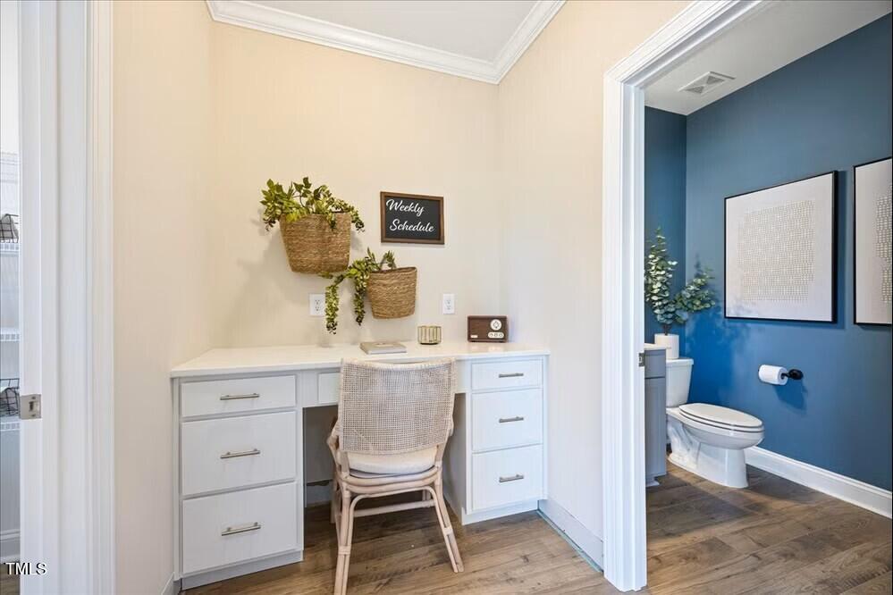 541 Forestville Road Wake Forest, NC 27587 - Photo 15 of 47 a bathroom with a toilet a sink and a mirror