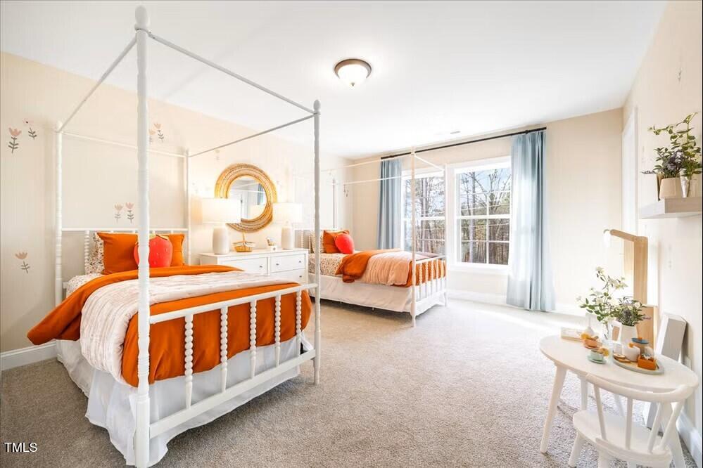 541 Forestville Road Wake Forest, NC 27587 - Photo 19 of 47 a bed room with a bed and a chair