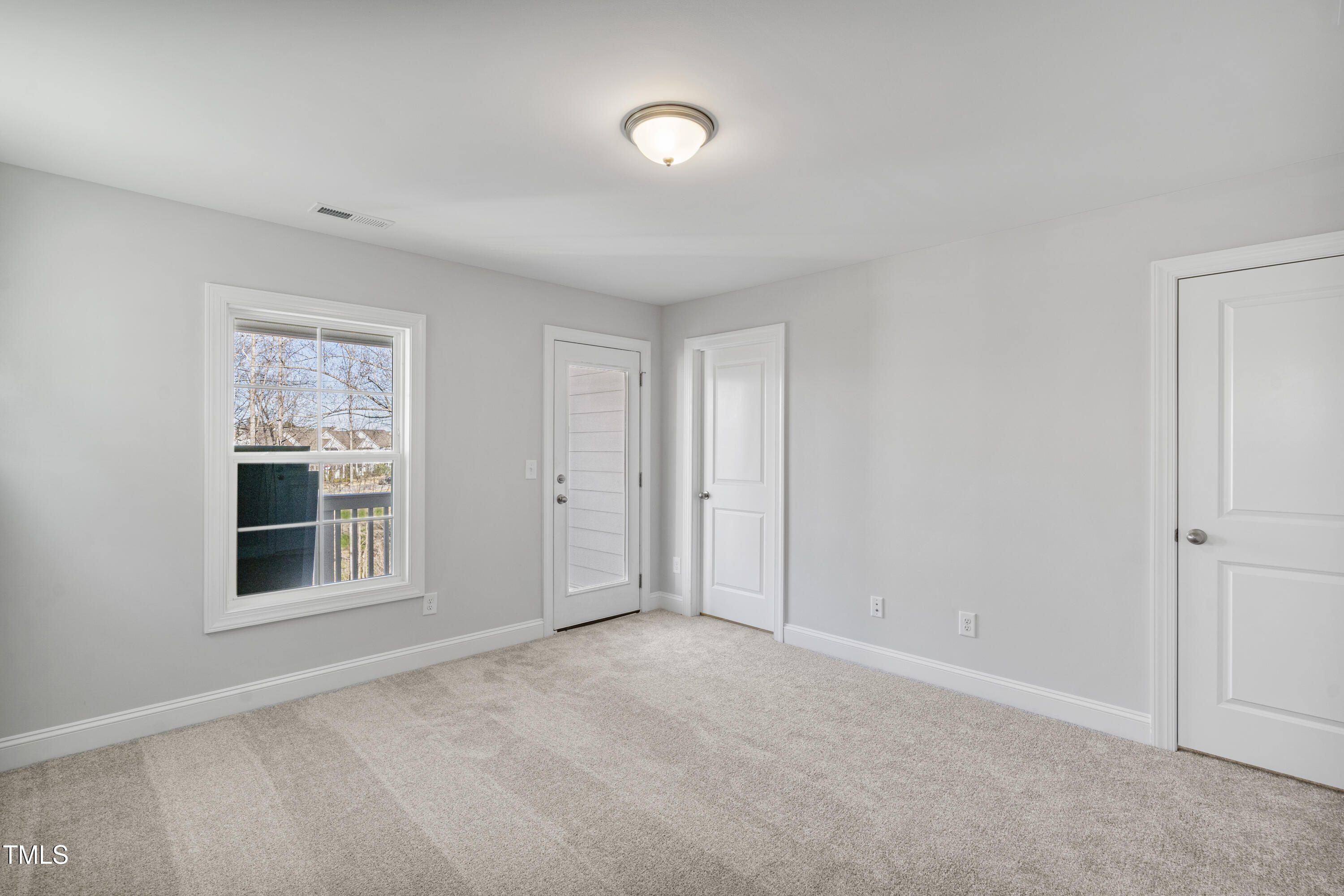 541 Forestville Road Wake Forest, NC 27587 - Photo 44 of 47 a view of an empty room with a window