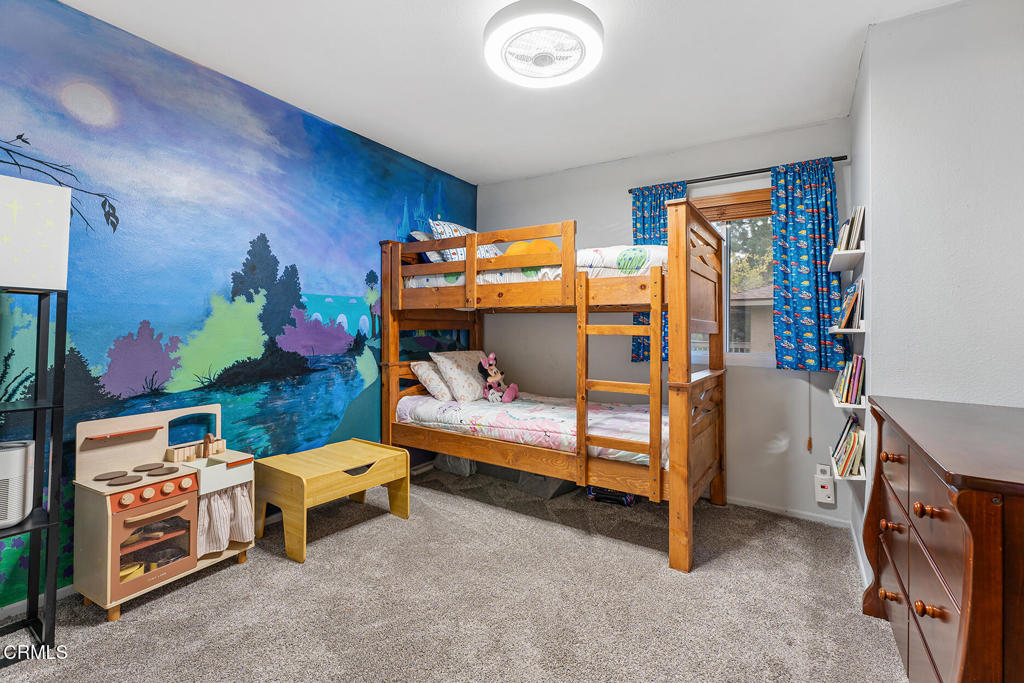 4448 Lubbock Drive, Unit C Simi Valley, CA 93063 - Photo 14 of 27 a bedroom with furniture and a baby crib
