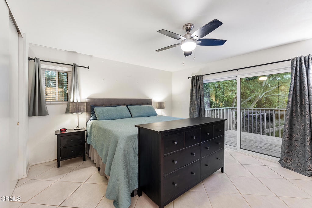 4448 Lubbock Drive, Unit C Simi Valley, CA 93063 - Photo 16 of 27 a bedroom with a bed and a large window