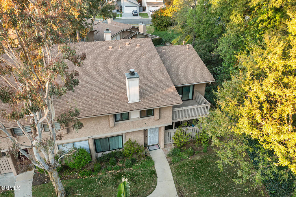 4448 Lubbock Drive, Unit C Simi Valley, CA 93063 - Photo 22 of 27 an aerial view of a house with a yard and large trees