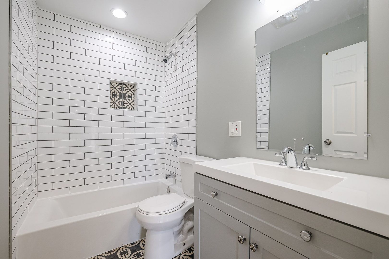 746 Walnut Street, Unit 2E Waukegan, IL 60085 - Photo 13 of 21 a bathroom with a sink a toilet and shower