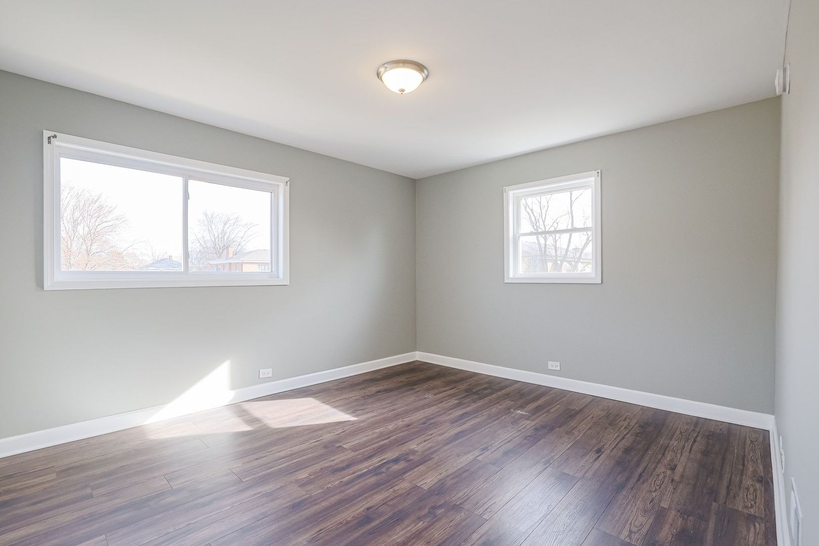 746 Walnut Street, Unit 2E Waukegan, IL 60085 - Photo 14 of 21 a view of empty room with wooden floor and fan