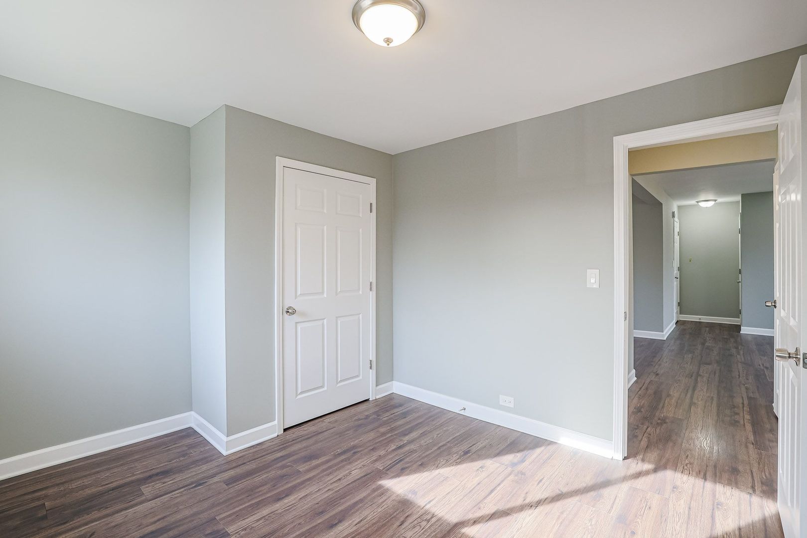 746 Walnut Street, Unit 2E Waukegan, IL 60085 - Photo 15 of 21 a view of a room with wooden floor