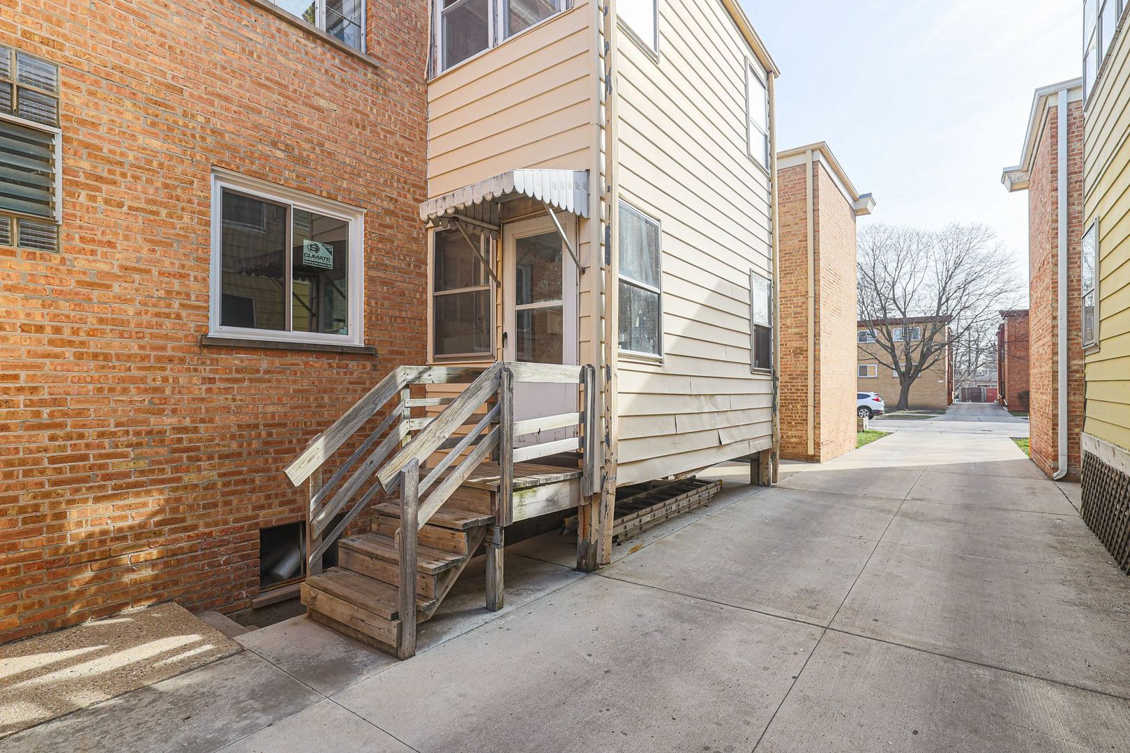 746 Walnut Street, Unit 2E Waukegan, IL 60085 - Photo 20 of 21 a view of a house with backyard and a stairs