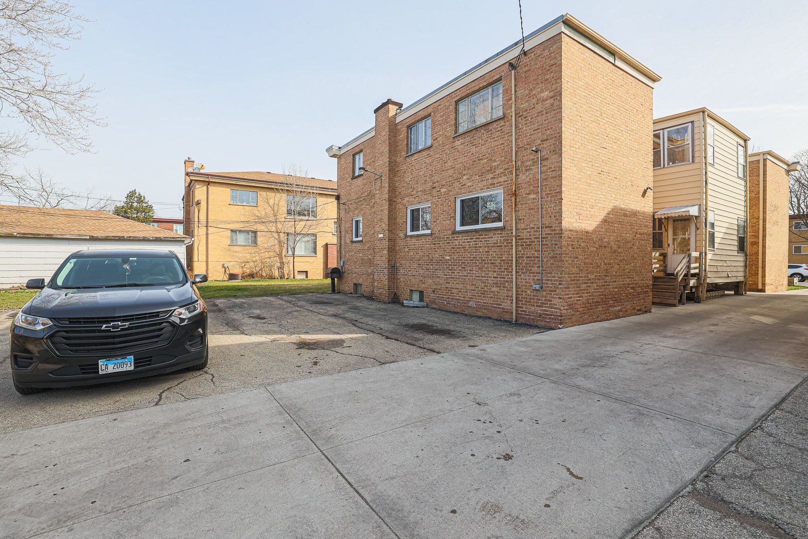 746 Walnut Street, Unit 2E Waukegan, IL 60085 - Photo 2 of 21 a view of a car parked in front of a house
