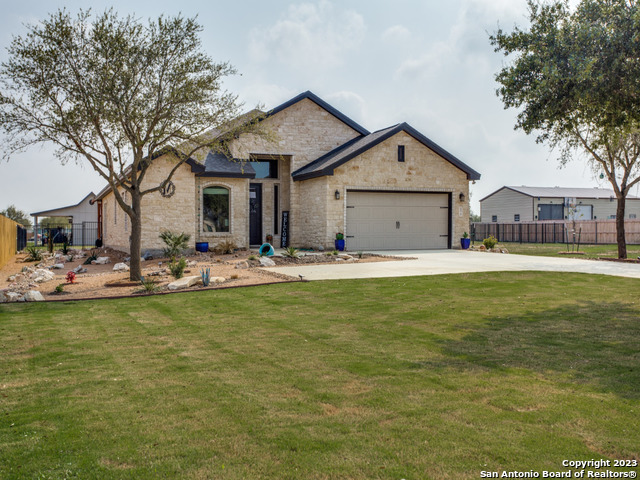 172 East Medium Meadow Drive Lytle, TX 78052 - Photo 1 of 1 a front view of a house with swimming pool and porch