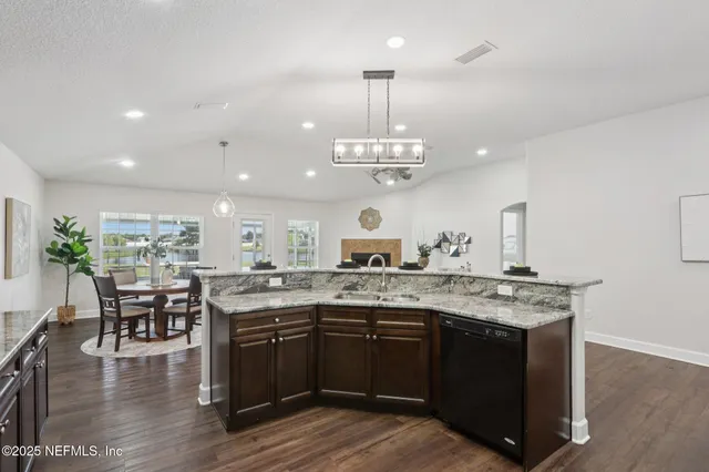 a kitchen with a table and chairs in it