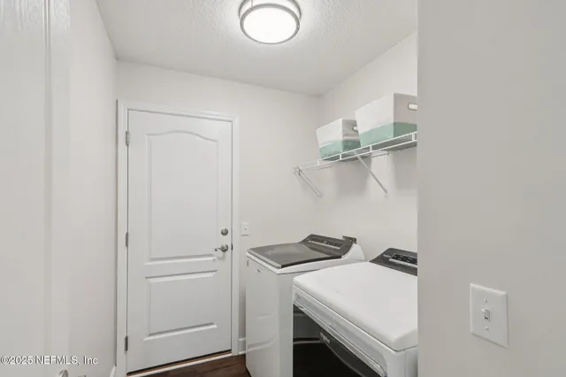 a storage room with washer and dryer